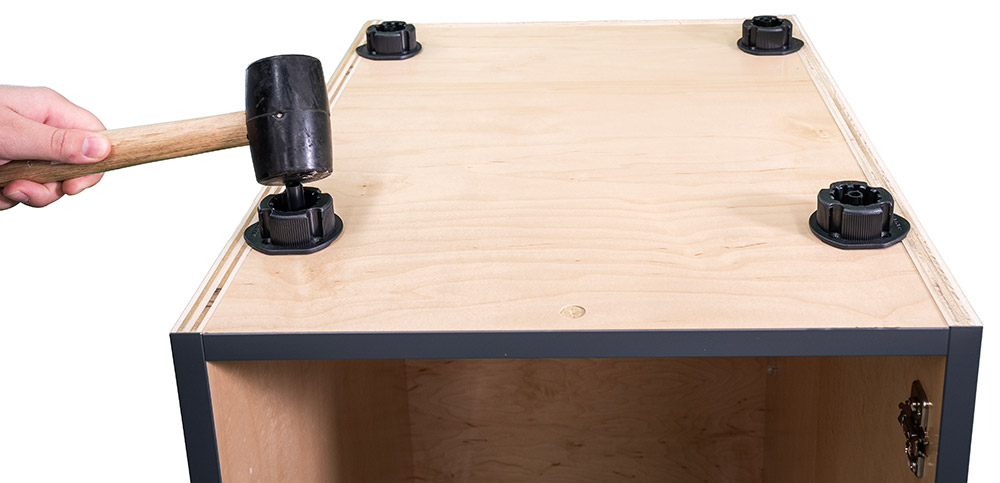 Drive center dowel into cabinet